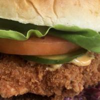 Chipotle Chicken Sandwich  · buttermilk fried, house-pickles, slaw, spicy aioli, lettuce, tomato, served with met friets