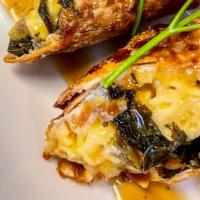 Soul Roll · Our deep fried roll with baked mac and cheese and collard greens topped with a savory yam gl...