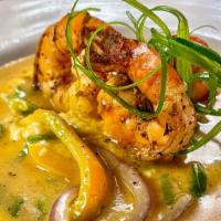 Shrimp Or Fish & Grits · Pick one tapping from Cajun shrimp, grilled catfish or grilled salmon over creamy cheddar gr...