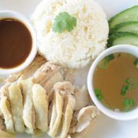 Kao Mun Gai · Poached chicken served with garlic ginger flavored rice, spicy soy bean sauce, fresh cucumbe...