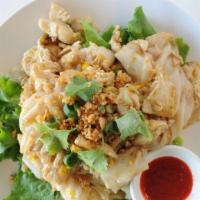 Garlic Chicken  Noodle · Wide rice noodles stir fried with chicken and egg in house special sauce, placed on a bed of...