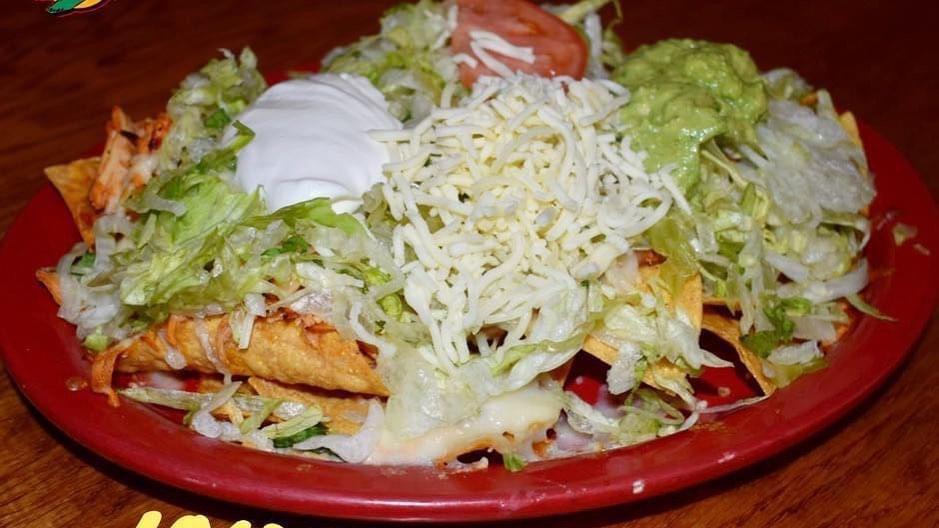 Nachos Supreme · SERVED WITH OUR FRESH DAY MADE CHIPS TOPPED WITH GROUND BEEF, CHICKEN, BEANS , QUESO, SHREDDED CHEESE, LETTUCE, TOMATO, SOUR CREAM AND GUACAMOLE