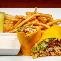 Buffalo Chicken Wrap · Fried chicken tenders tossed in a buffalo-style hot pepper sauce and wrapped in a chipotle t...