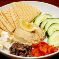 Hummus · Served with cucumber, oven-roasted tomatoes, kalamata olives, feta cheese, olive oil, and pi...