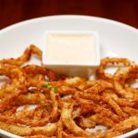 Homemade Onion Rings · Freshly sliced onion, hand battered and fried to a crisp golden brown.  Served with chipotle...