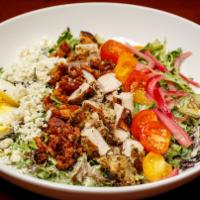 Cobb Salad · Mixed greens tossed with green goddess dressing and topped with grilled chicken, avocado, cr...