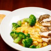 Mac N Cheese · Cavatappi pasta tossed in our award-winning six cheese sauce. Topped with garlic-buttered br...