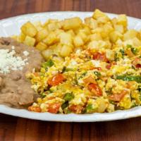 Huevos A La Mexicana · Scrambled eggs with diced tomato, jalapeño, onion and side of fried potatoes and beans.