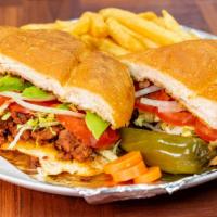 Torta · Mexican sub sandwich with mayo, tomato, lettuce, onion, avocado, beans, meat and side of fri...