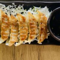 Chicken Gyoza (6) · Pan fried pot stickers with chicken and veggies, served with ponzu sauce.