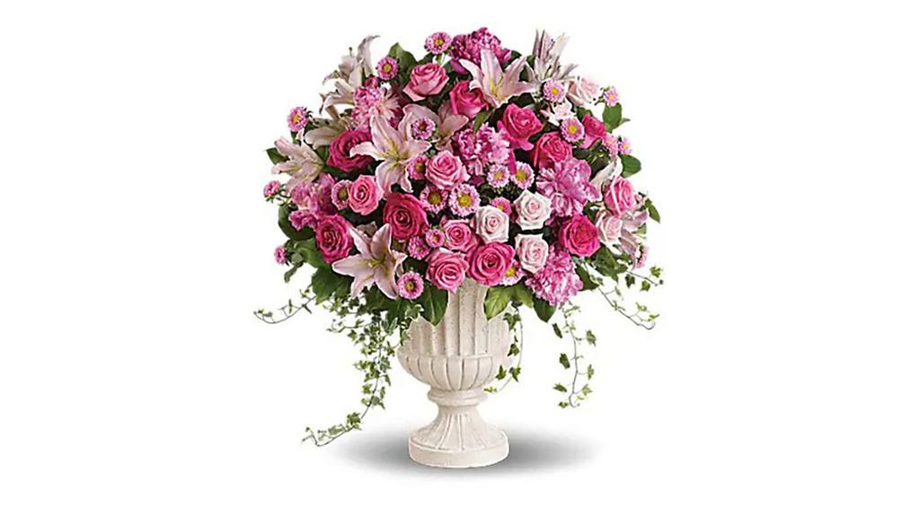 Passionate Pink Garden Arrangement · Standard. Make a grand statement with this impressive pink arrangement! Arranged in a classical urn, the pink peonies, roses, lilies and asters are a feminine, awe-inspiring tribute to the beauty of nature and true love. Lush pink, light pink and hot pink blooms including oriental lilies, Matsumoto asters, roses and peonies are accented with variegated ivy and rich green salal in a classical urn.