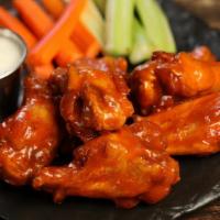 Classic · 8 classic buffalo sauce wings, served with carrots & celery and a choice of blue cheese or r...
