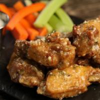 Garlic Parmesan · 8 garlic parmesan wings, served with carrots & celery and a choice of blue cheese or ranch f...