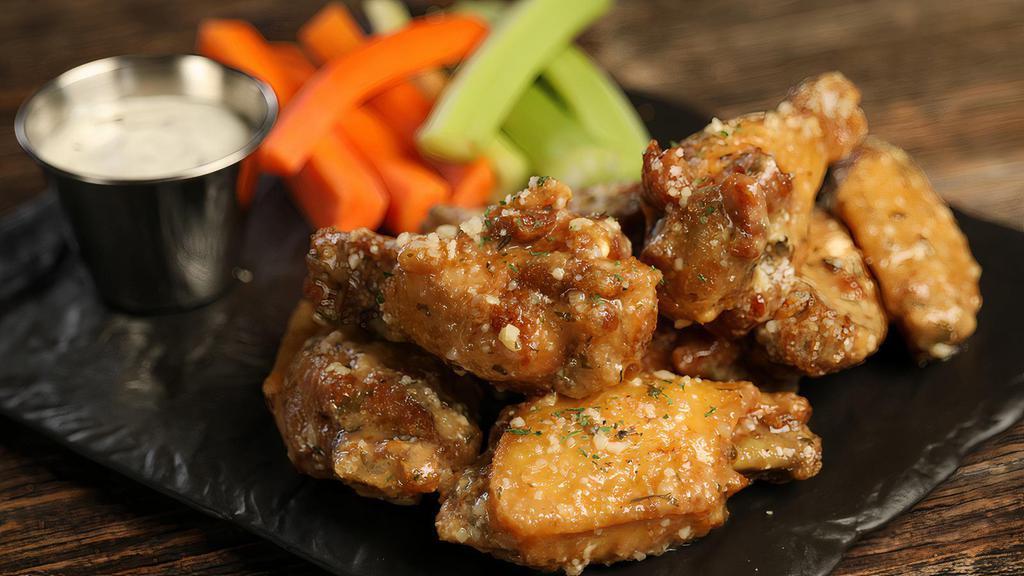 Garlic Parmesan · 8 garlic parmesan wings, served with carrots & celery and a choice of blue cheese or ranch for dipping (mild heat)