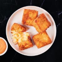 Classic Mac Bites · 4 Golden-fried mac & cheese bites served with house sauce for dunking