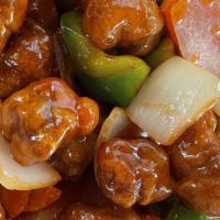 Sweet & Sour Pork · Corn starch battered pork, fried and tossed with bell peppers, carrots, white onions, and pi...