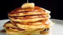 Buttermilk Pancakes · Old school shortstack served with whipped butter and maple syrup. Add chocolate chips for $1.