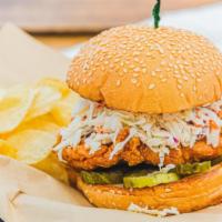Pickle Brined And Fried Chicken Sandwich · Best maid pickle brined chicken breast topped with creamy slaw, pickles and mayo, served on ...