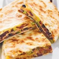 Quesadilla · Kickin’ it old school. A cheese quesadilla stuffed with pico de gallo and served with sour c...