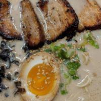 Tonkotsu Ramen · Rich pork broth, thin noodles, tender pork chashu, green onions, Japanese mushrooms, sesame ...
