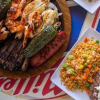 Parrillada Mixta (2) · Beef & Chicken Fajitas, Grilled shrimp and spicy sausage. Served with rice, refried beans, p...