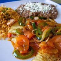 Tilapia A La Mexicana · Sautéed with poblano peppers, onions, tomatoes and jalapeños