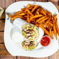 Chicken Shawarma Wrap · Thin slices of chicken, garlic sauce, pickles and potatoes.