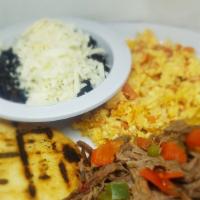 Desayuno Criollo · Scrambled eggs w/ chopped onions and tomatoes, shredded beef, black beans, cheese and arepa.