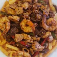 Parrilla Mar Y Tierra · juicy Grilled chicken, Steak, Sausage, Shrimps, Calamari, Onions and Peppers over a bed of f...