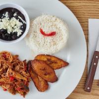 Pabellon Criollo · Shredded beef, white rice, sweet plantains and beans.