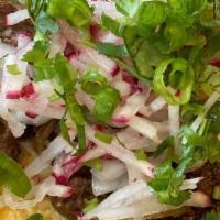 Korean Beef Taco · Onions, scallions. cilantro and radishes on corn tortilla.