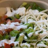 Adobo Chicken Bowl · Lettuce, rice, beans, cheese, sour cream, and pico de gallo.