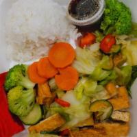 Tofu Bowl · Served with rice and stir-fried vegetables