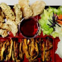Kims' Special House Special · Contains 2 shrimp, 2 sweet potatoes, 2 onions, 2 zucchinis tempura and teriyaki chicken. Ser...