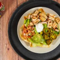 Taco Salad · Crispy tortilla shell filled with white rice, black beans, guacamolc, pico de gallo and sour...