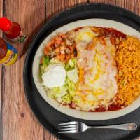 Beef Enchiladas · Two yellow soft corn tortillas filled with ground beef, topped with red sauce and melted che...