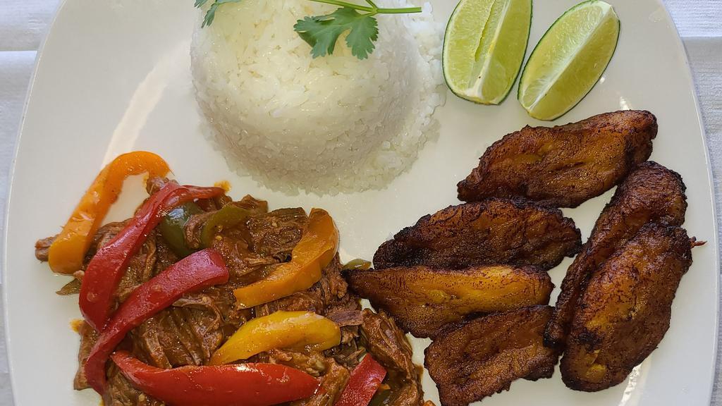Ropa Vieja · Slow cooked shredded beef, served with fried plantains black beans with white rice