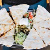 Quesadillas Fajita - Appetizer · Flour tortillas filled with fire-roasted chiles, grilled onion and Monterey Jack and cheddar...