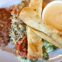 Flautas · Crispy flour tortillas, rolled with seasoned ground beef with pico de gallo and Monterey Jac...