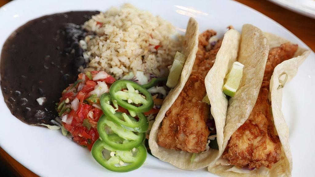 Tacos Baja  Mahi-Mahi · Mahi Mahi Grilled or lightly battered. Corn or homemade flour tortillas served with cilantro cabbage slaw, pico de gallo, fresh jalapeño and chipotle aioli. Served with green chile rice & refried beans (or substitute mashed black beans.)