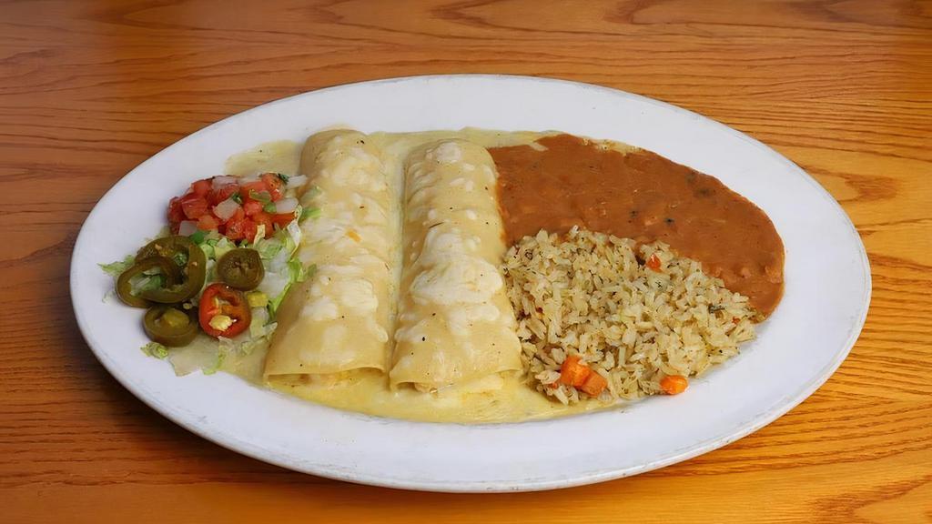 Enchiladas Chicken [Gs] · Hand-pulled chicken and Monterey Jack cheese, your choice of sauce: chile verde, green chili deluxe or chile con queso. Served with green chile rice & refried beans (or substitute mashed black beans.). Can be prepared Gluten Free upon Request.  Online Orders select the Make it GF! modifier.