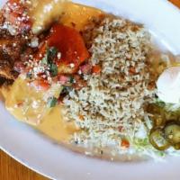 Chimichangas Mini- Combo · Two crispy flour tortillas one with  seasoned ground beef with chile con carne sauce and one...
