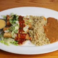 Taquitos Chicken Deluxe · Five crispy corn tortillas rolled with hand-pulled chicken. Topped with red chile sauce, shr...