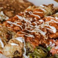 Rellenos Beef · Two fire-roasted, stuffed, breaded and fried Anaheim peppers with Beef: seasoned ground beef...