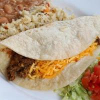 Kid Taco Flour · Soft flour tortilla with your choice of hand-pulled chicken or ground sirloin, lettuce, toma...