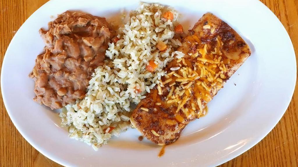 Kid Enchilada Cheese · Cheese enchilada with chile con carne or chile con queso. Served with your choice of french fries, apple sauce or green chile rice and refried beans.