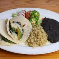 Tacos Veggie · Homemade flour tortillas with mashed black beans, cornmeal fried avocado, pico de gallo, fre...
