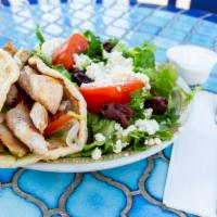 Chicken Gyro (Deluxe) · Grilled chicken breast filets, with lettuce tomatoes, onions and cucumber sauce wrapped in t...