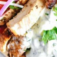 Chicken Gyro (Sandwich) · Grilled chicken breast filets, with lettuce tomatoes, onions and cucumber sauce wrapped in t...
