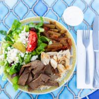Taste Of Crete · A sampling of our grilled gyro meat and chicken on a bed of rice pilaf served with green bea...